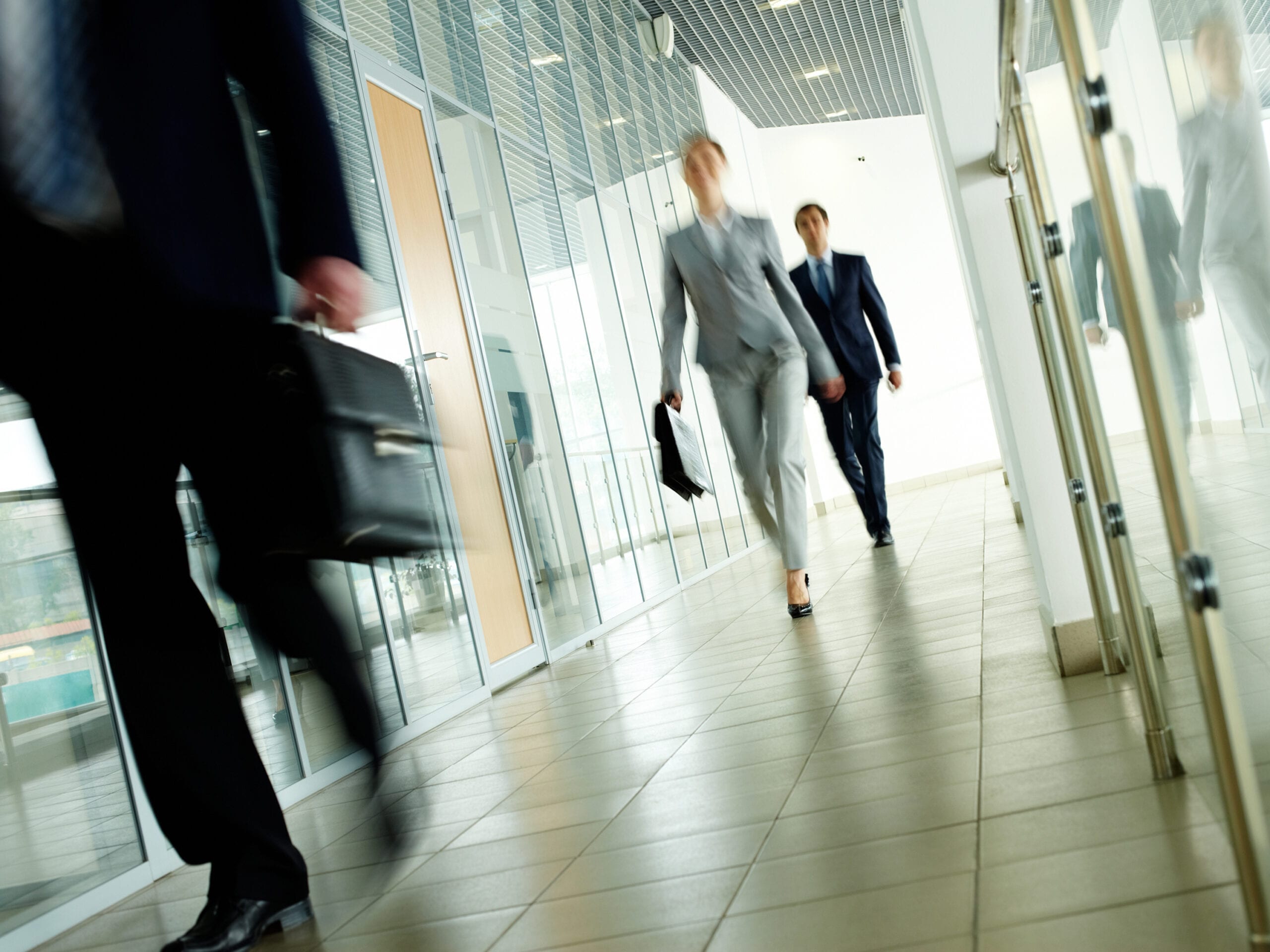 Business people walking down a hallway. RDM has extensive experience in employment and labor law.