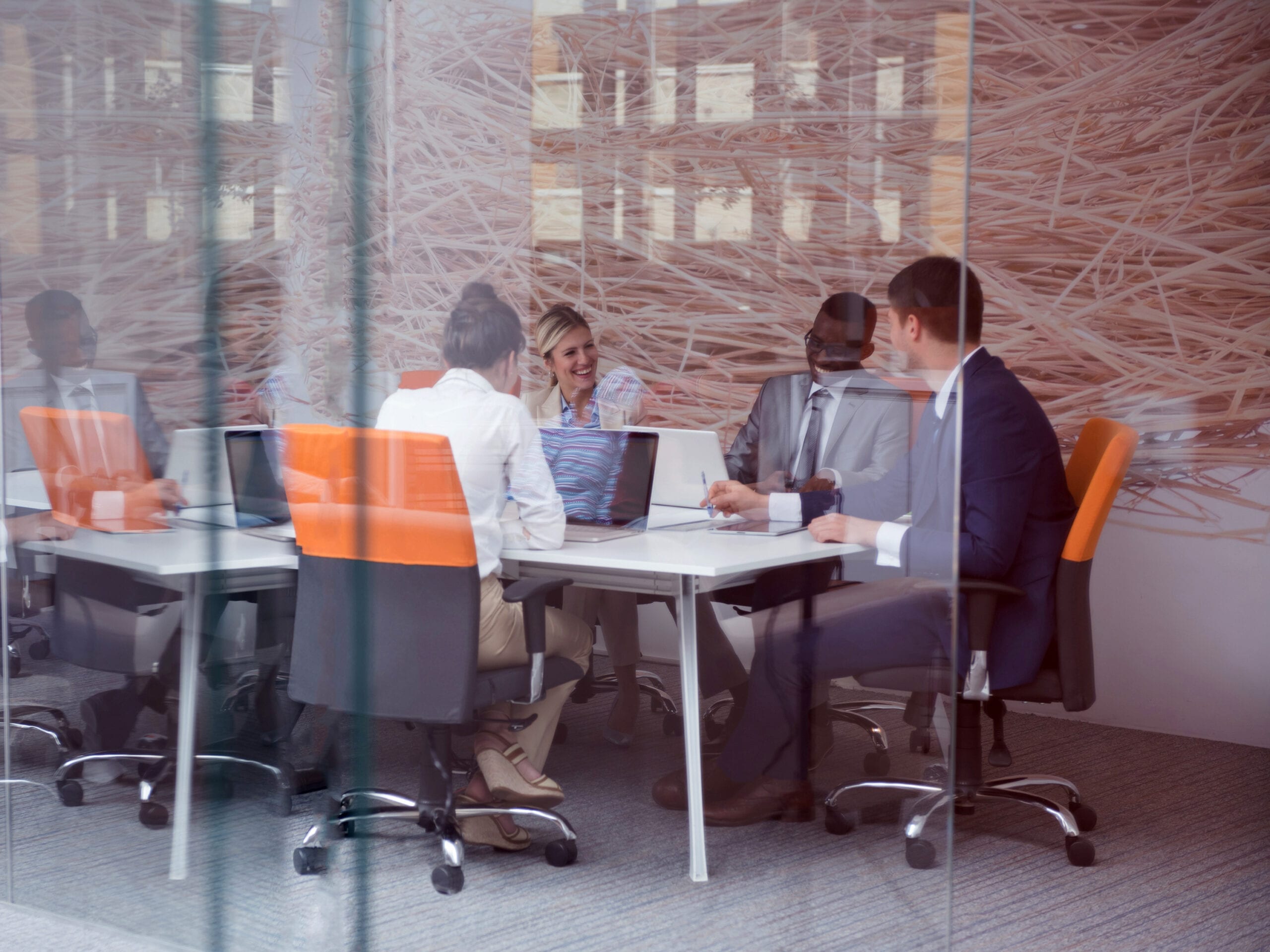 Professionals doing business in a conference room. RDM has extensive business law experience, including formation, contracts, and more.