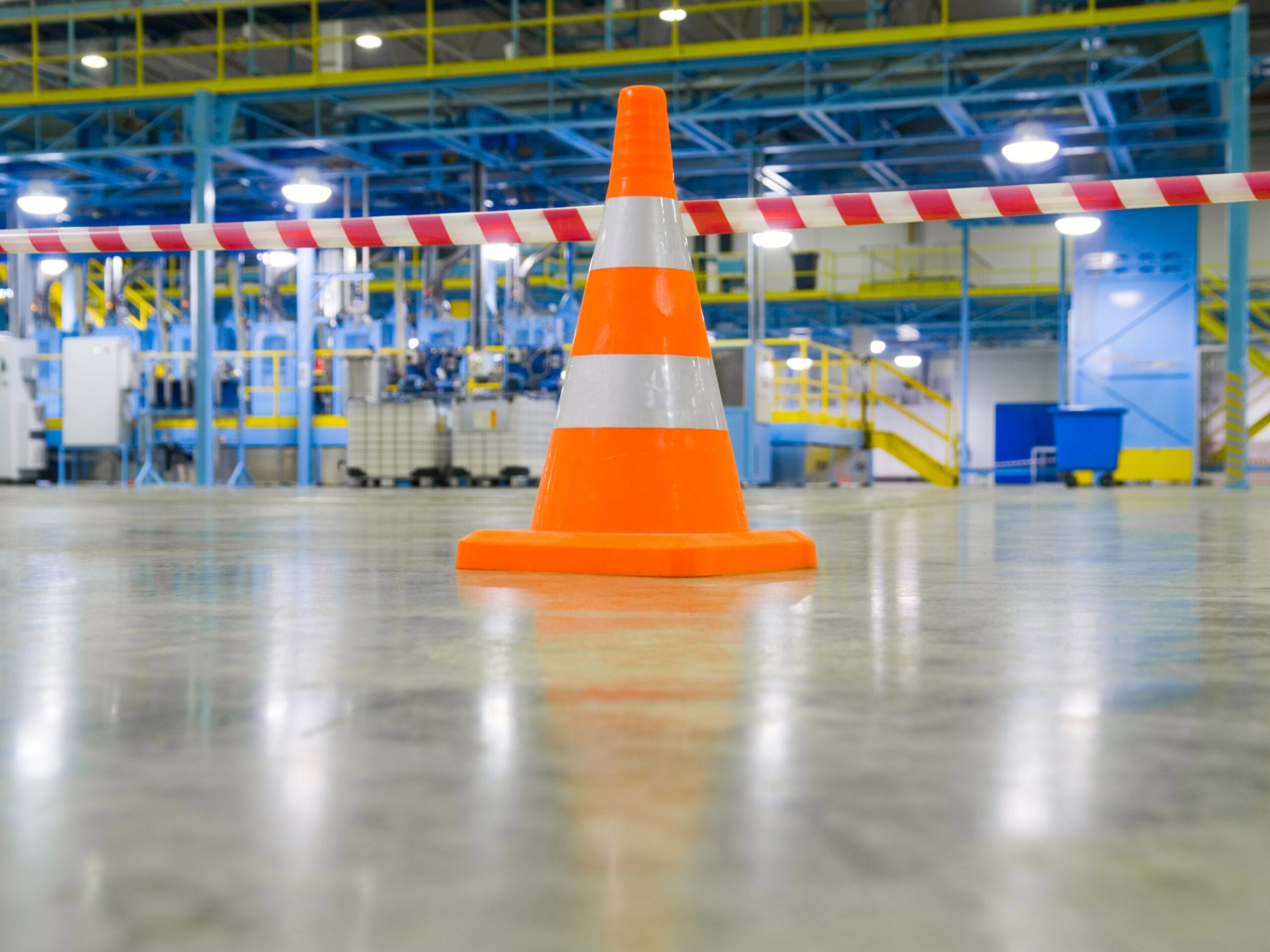 A safety cone in a manufacturing facility. RDM has extensive experience defending premises liability claims.