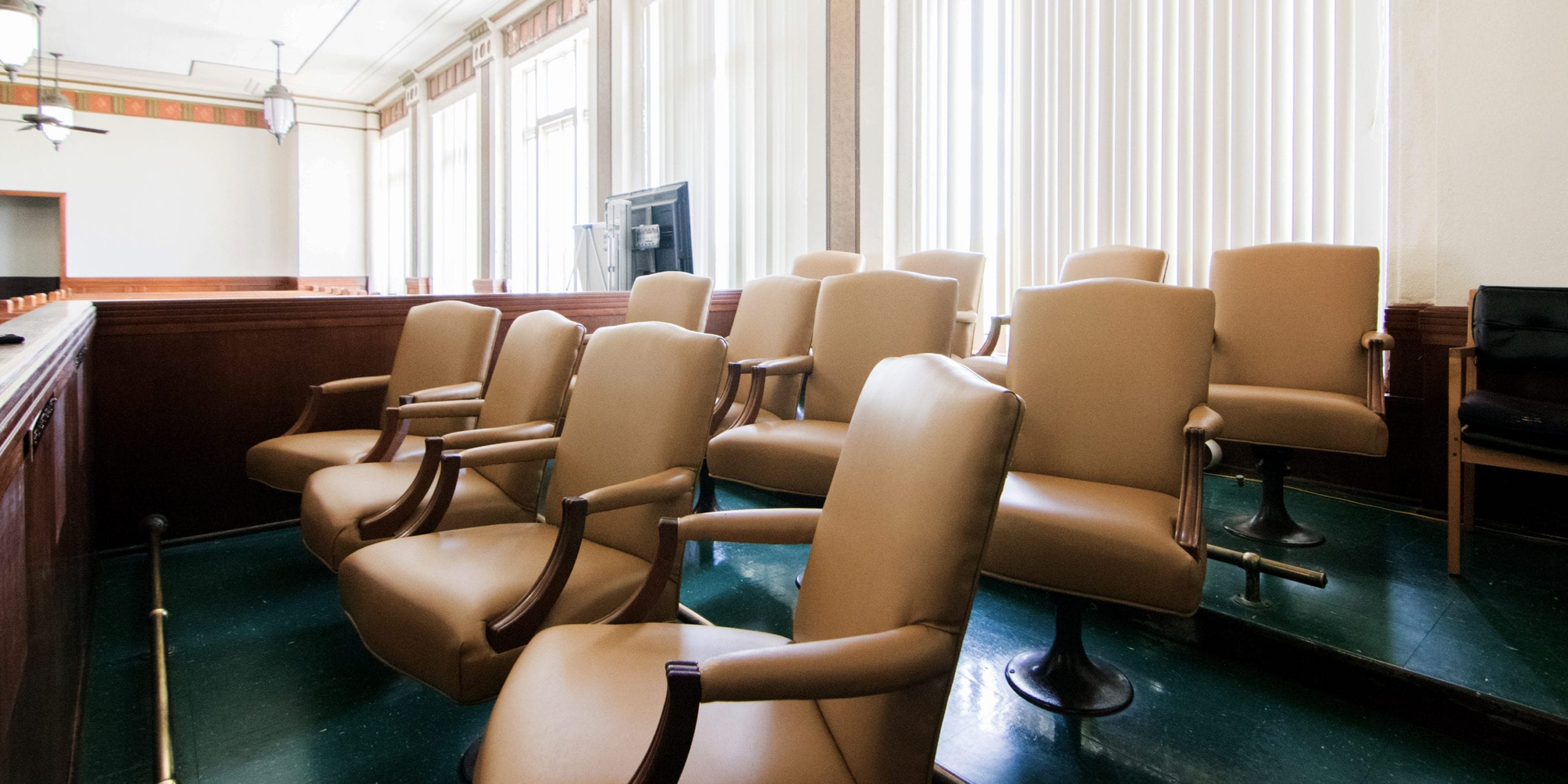 Chairs in a jury box. Photo by Flickr user Patrick Feller.