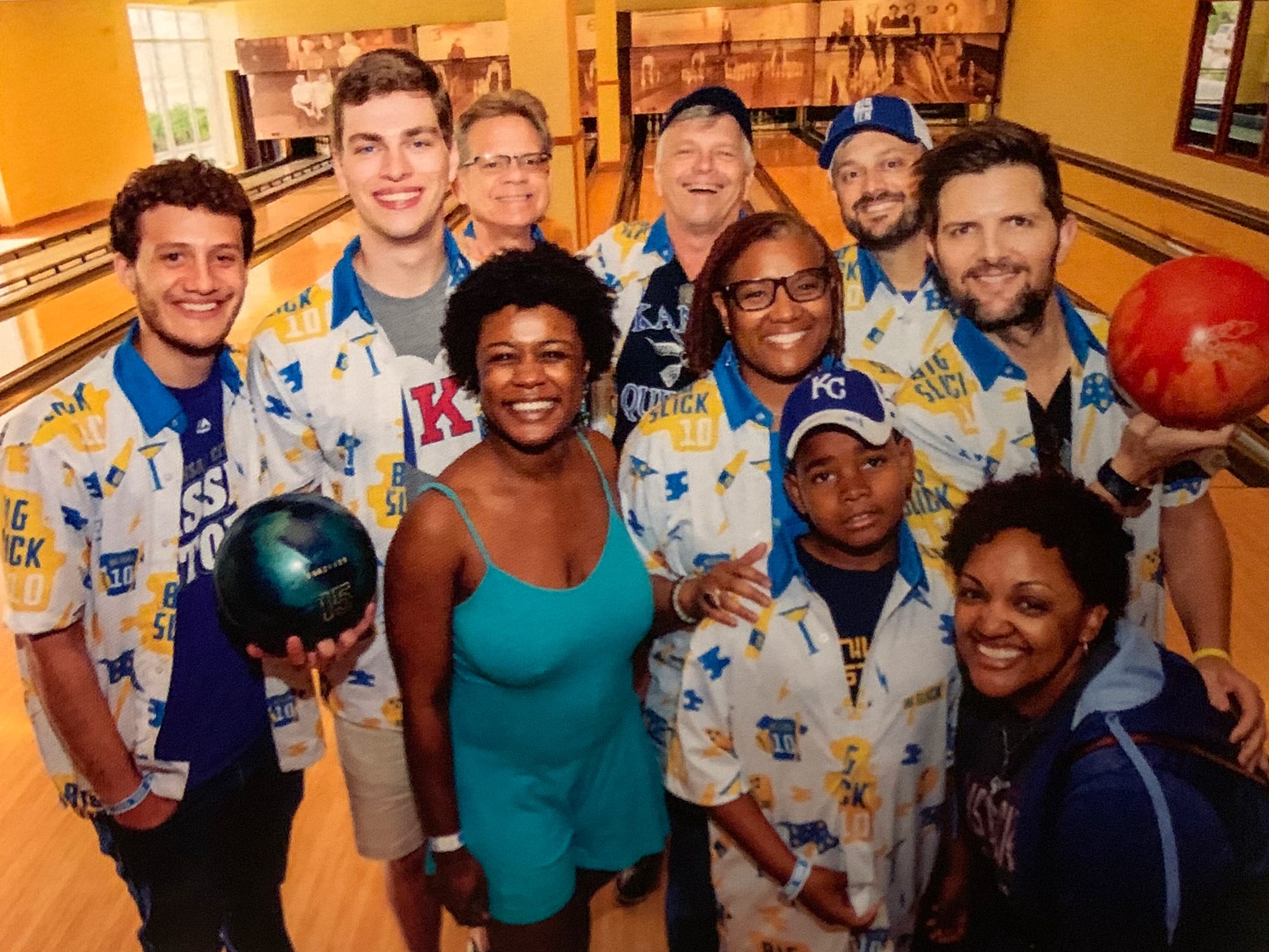 RDM founding members Kurt Rasmussen, Clay Dickey, and their families bowling with actor Adam Scott during the Big Slick Celebrity Weekend.